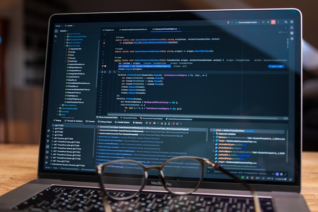Computer code on dark monitor screen in developer environment